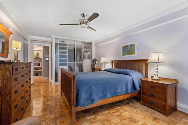 bedroom featuring baseboards, crown molding, and ceiling fan