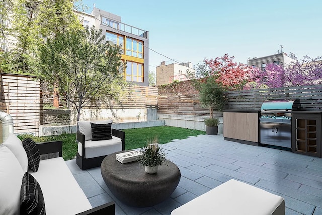 view of patio / terrace featuring a fenced backyard, an outdoor hangout area, and area for grilling