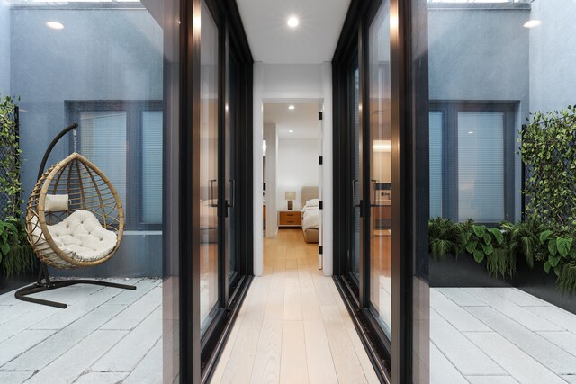 hall featuring recessed lighting and wood finished floors