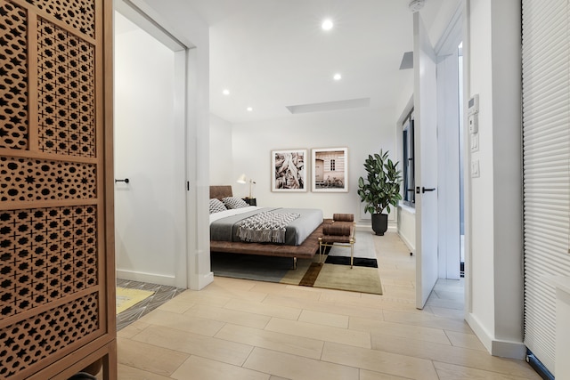 bedroom with recessed lighting, baseboards, and wood tiled floor