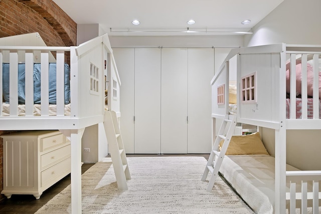 bedroom featuring recessed lighting and wood finished floors