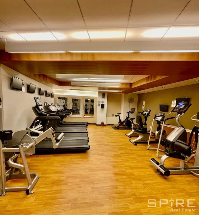 99 John St Unit 1012, New York City, NY 10038 - gym with a tray ceiling and light wood-style floors