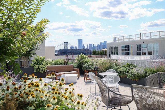 view of patio with a city view and outdoor lounge area