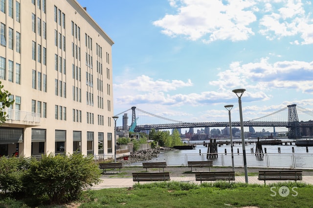 view of community featuring a view of city and a water view