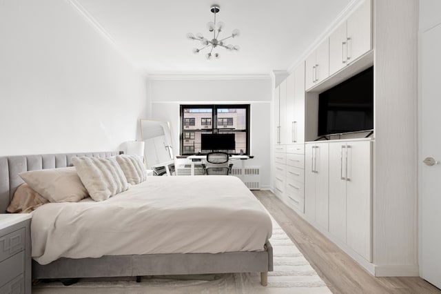 bedroom with radiator, light wood-type flooring, baseboards, an inviting chandelier, and crown molding