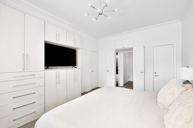 bedroom with ornamental molding, wood finished floors, and a chandelier
