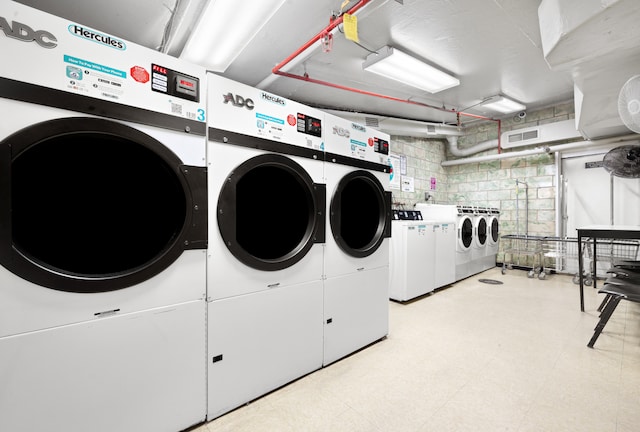 shared laundry area featuring independent washer and dryer