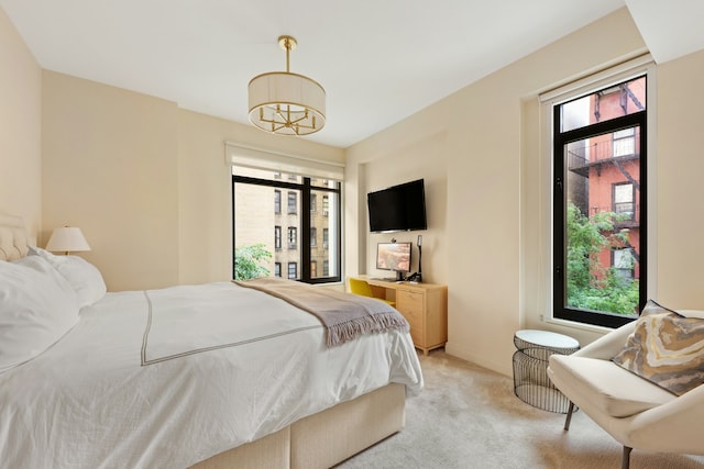 bedroom featuring light carpet