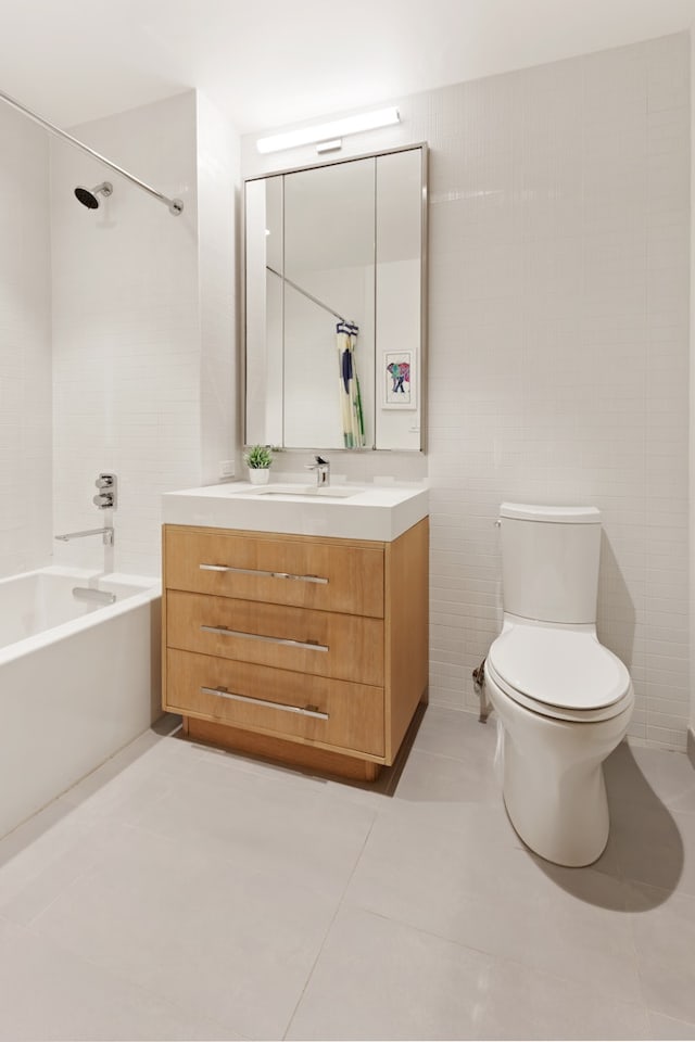 bathroom with toilet, bathtub / shower combination, vanity, and tile patterned flooring