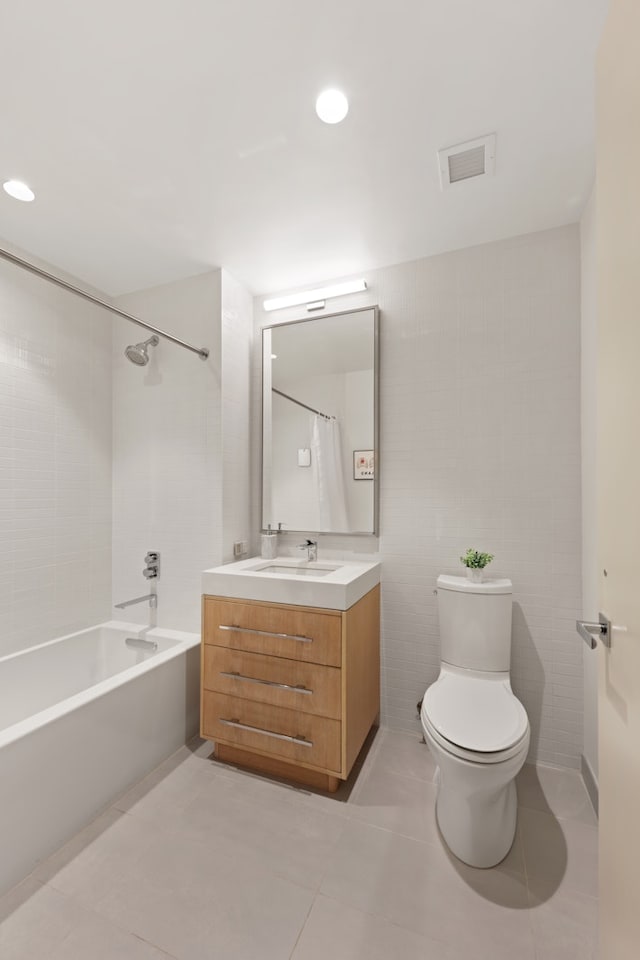 bathroom with vanity, visible vents, tile patterned flooring, shower / washtub combination, and toilet