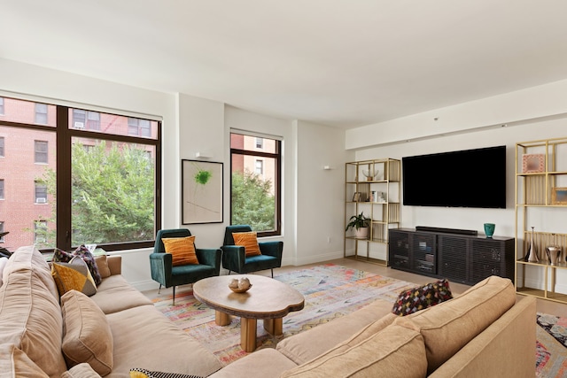 living room featuring light wood-style floors and baseboards