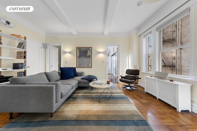 living room featuring beam ceiling, radiator, and visible vents