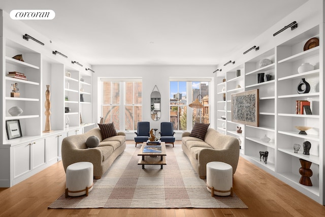 living room featuring visible vents and light wood-type flooring