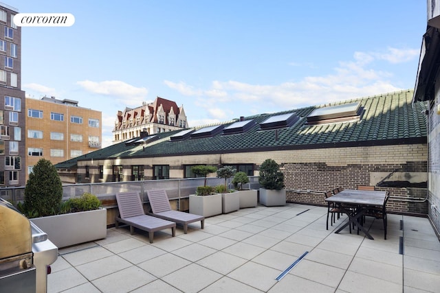 view of patio / terrace with grilling area and outdoor dining area