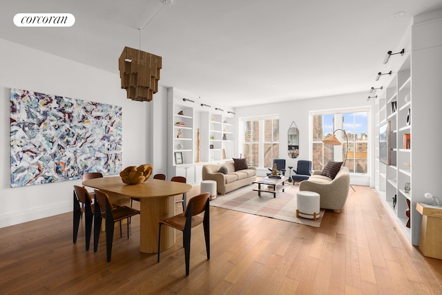 dining room featuring visible vents and wood-type flooring