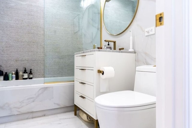 full bath with vanity, toilet, marble finish floor, and walk in shower