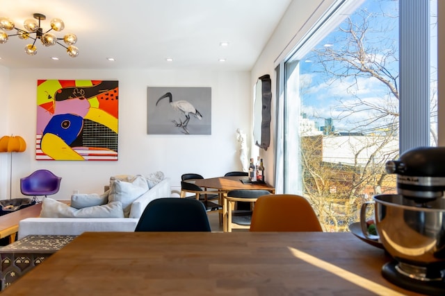 living room featuring a notable chandelier and recessed lighting