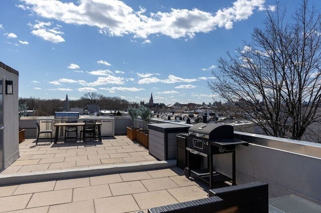 view of patio with a grill and an outdoor kitchen