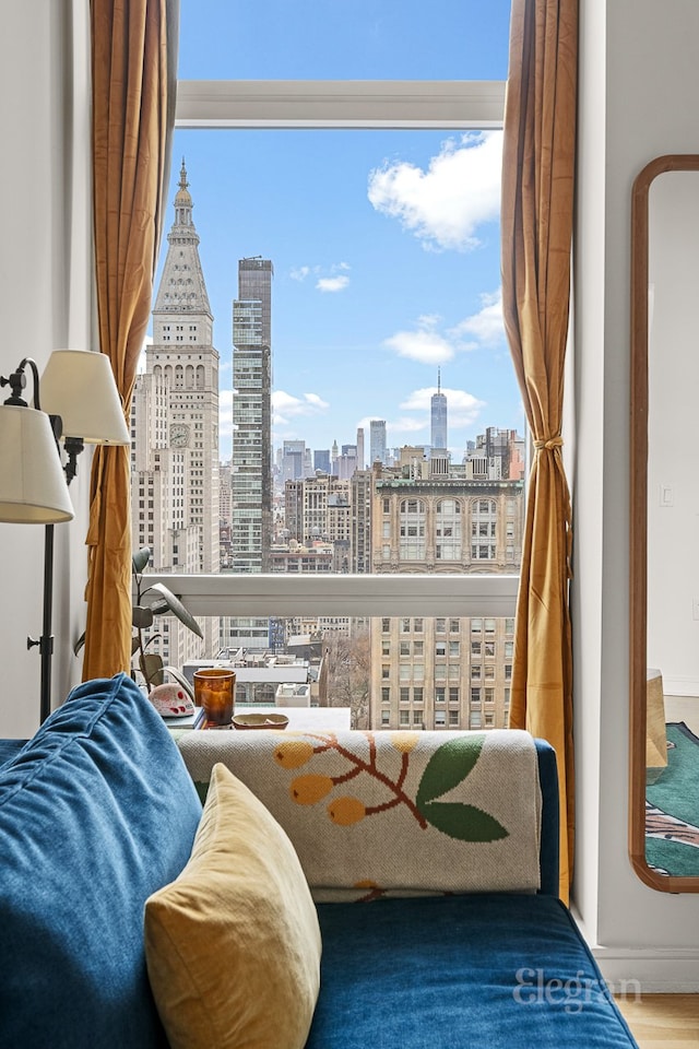 interior space featuring a city view and wood finished floors