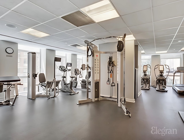 workout area with visible vents and a drop ceiling