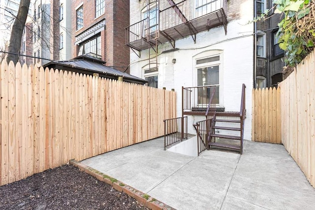 view of patio / terrace featuring fence