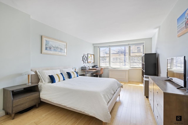 bedroom featuring light wood-style floors