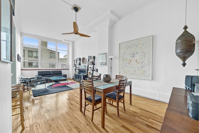 dining room with ceiling fan and hardwood / wood-style floors