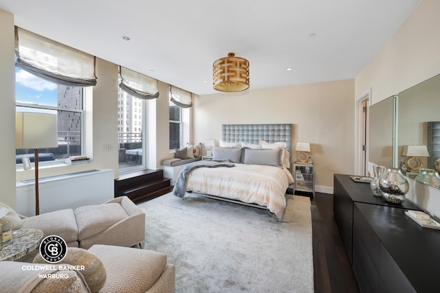 bedroom featuring recessed lighting, baseboards, and wood finished floors