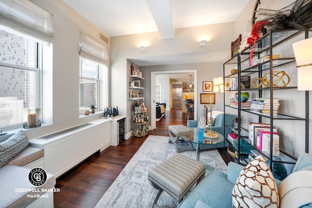 interior space with visible vents, baseboards, and dark wood-type flooring