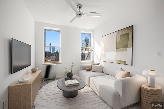 living room featuring radiator heating unit and ceiling fan