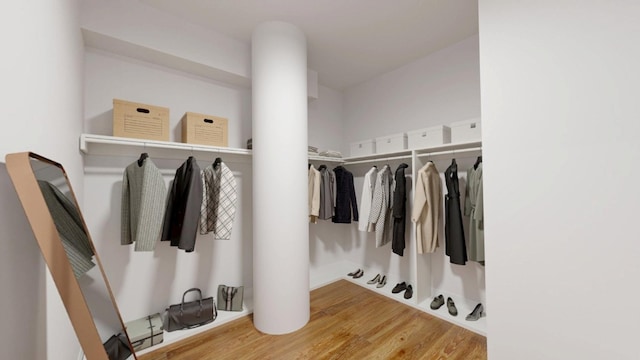 27-28 Thomson Ave Unit S415, New York City, NY 11101 - walk in closet featuring wood finished floors