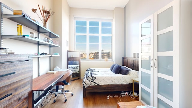 bedroom with wood finished floors