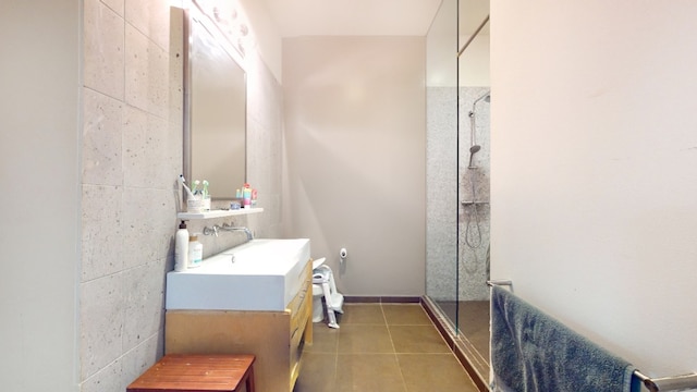 full bathroom with vanity, tile patterned floors, and a walk in shower