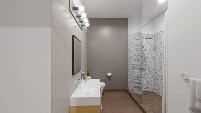 27-28 Thomson Ave Unit S415, New York City, NY 11101 - bathroom with walk in shower, vanity, and tile patterned flooring