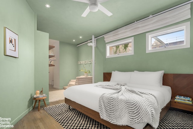 bedroom featuring hardwood / wood-style flooring, recessed lighting, and baseboards