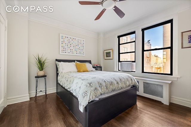 bedroom featuring radiator heating unit, dark wood-style floors, and ornamental molding