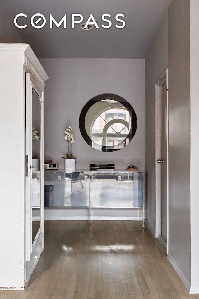 corridor with wood-type flooring