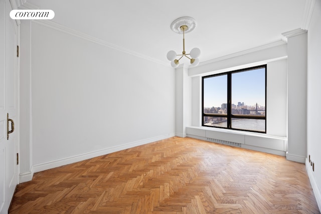 empty room featuring visible vents, a view of city, ornamental molding, an inviting chandelier, and baseboards