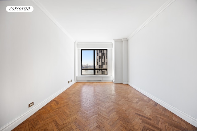 empty room with visible vents, baseboards, and ornamental molding