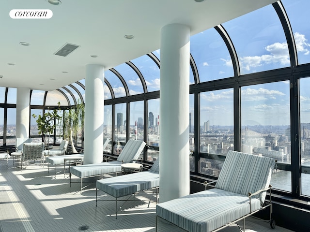 interior space featuring a view of city and visible vents
