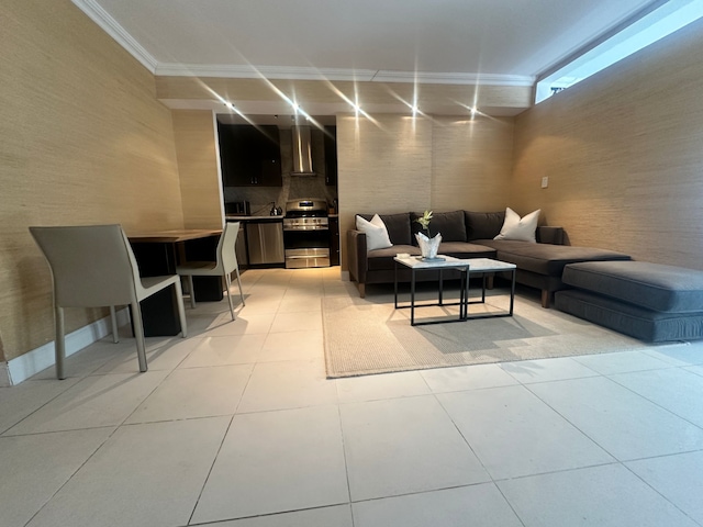 living room featuring light tile patterned floors and ornamental molding