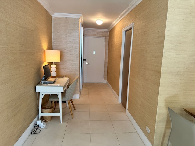 hall featuring crown molding, light tile patterned flooring, and baseboards