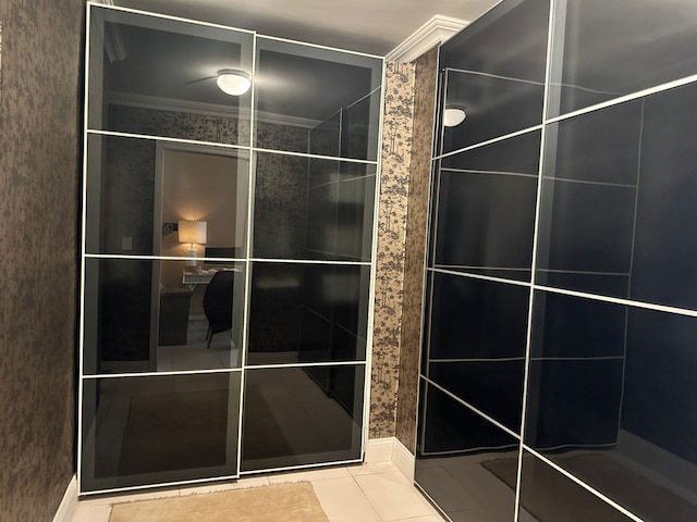 bathroom featuring tile patterned flooring and ornamental molding