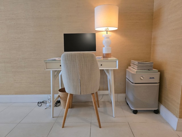 home office with light tile patterned flooring and baseboards