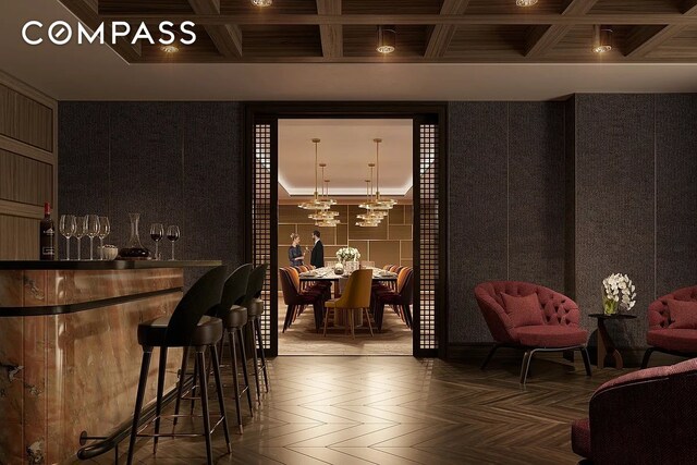 515 W 18th St Unit 403, New York City, NY 10011 - bar area featuring coffered ceiling, beamed ceiling, and a chandelier