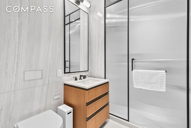 515 W 18th St Unit 403, New York City, NY 10011 - bathroom with toilet, vanity, and tile walls
