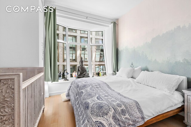 515 W 18th St Unit 403, New York City, NY 10011 - bedroom with light wood-style flooring