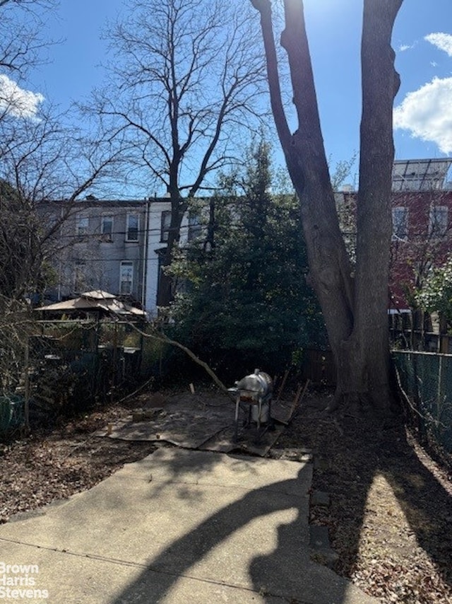 view of yard featuring a patio area and fence