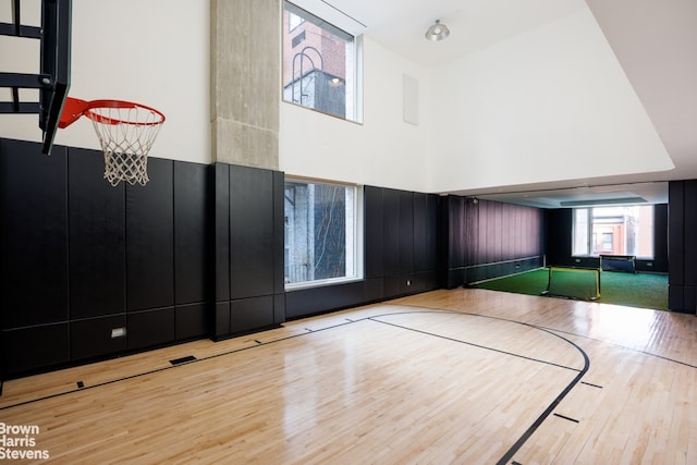 view of sport court featuring basketball hoop