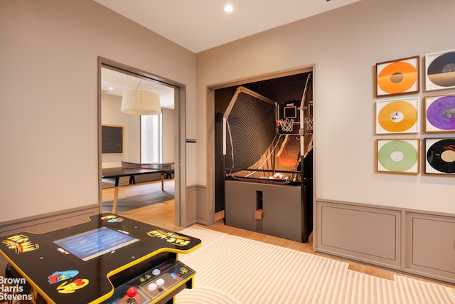 office with light wood-style flooring and recessed lighting